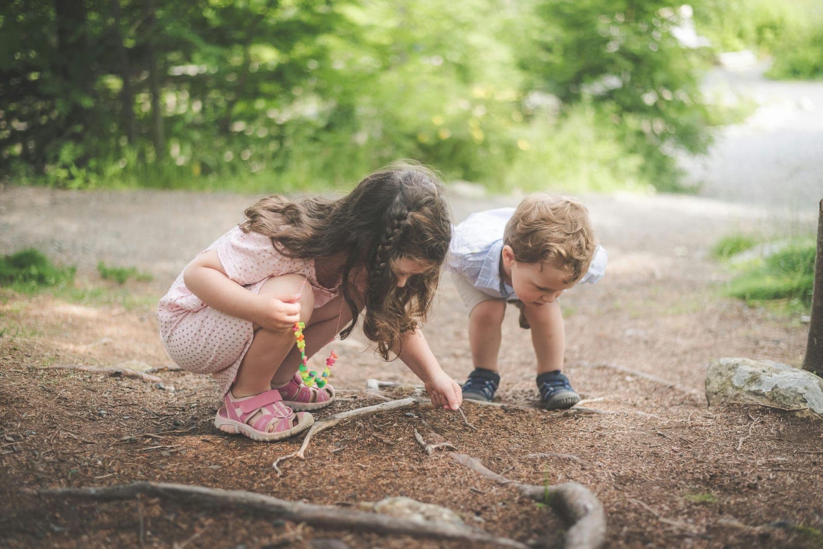Kids exploring a Brooklyn park during a nature day camp.