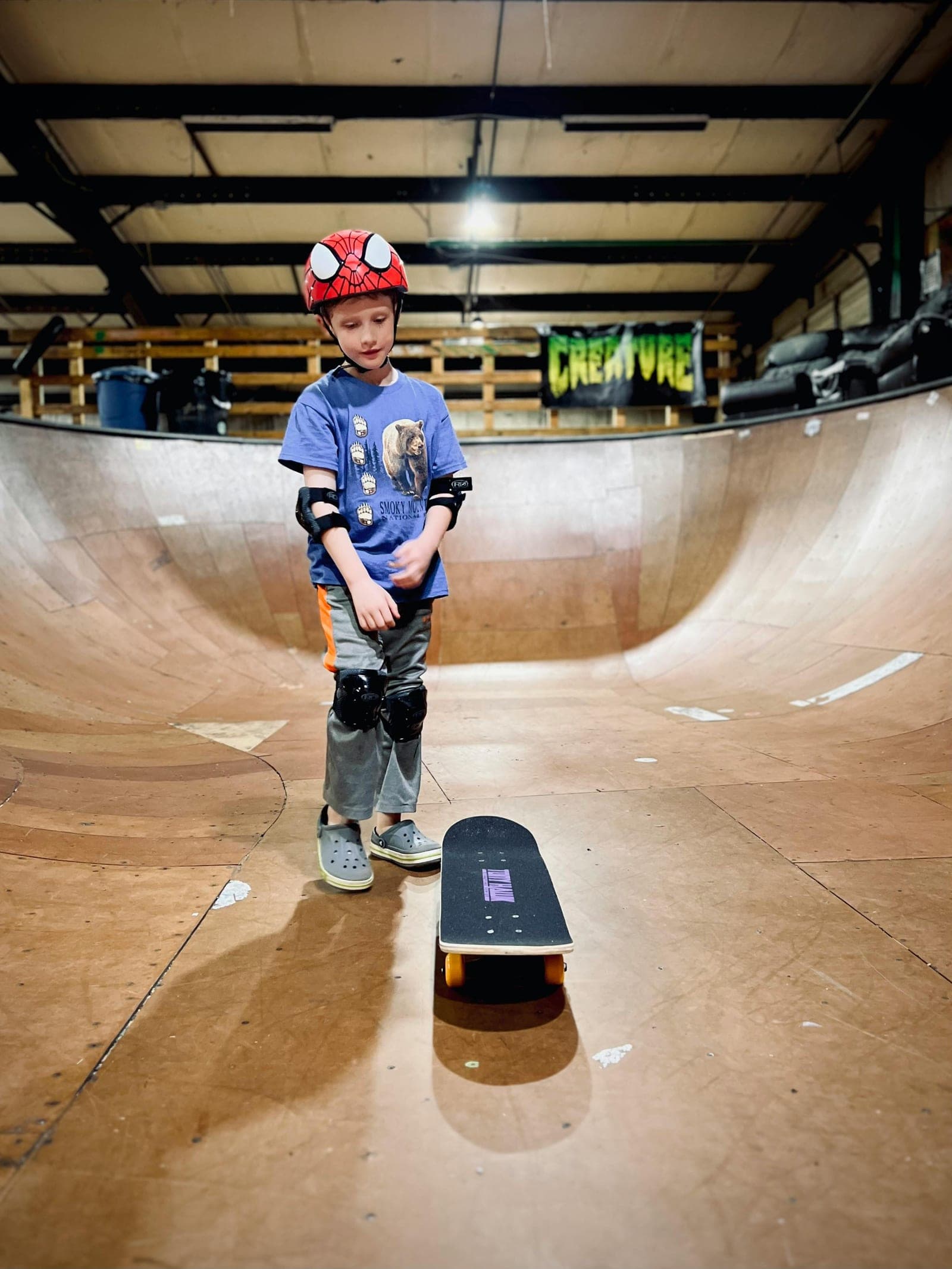 Kids learning to skate at a Brooklyn summer skateboarding camp.